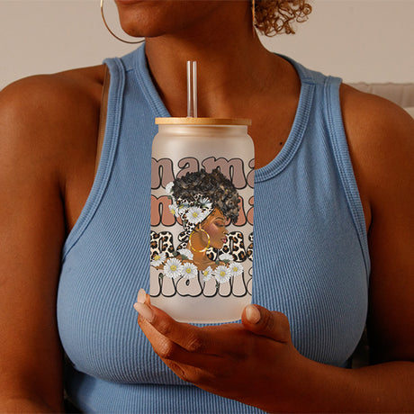 Woman holding Frosted 16oz Afro Mama Glass Tumbler. An Afrocentric motherhood gift.