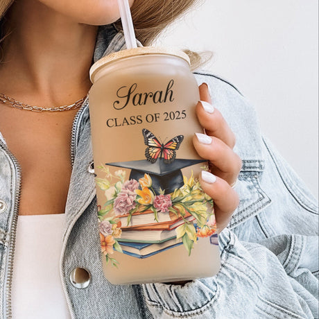 Personalized glass graduation tumbler with floral design, custom name and year printed on the cup. Custom glass can, perfect gift for Class of 2025 graduates.