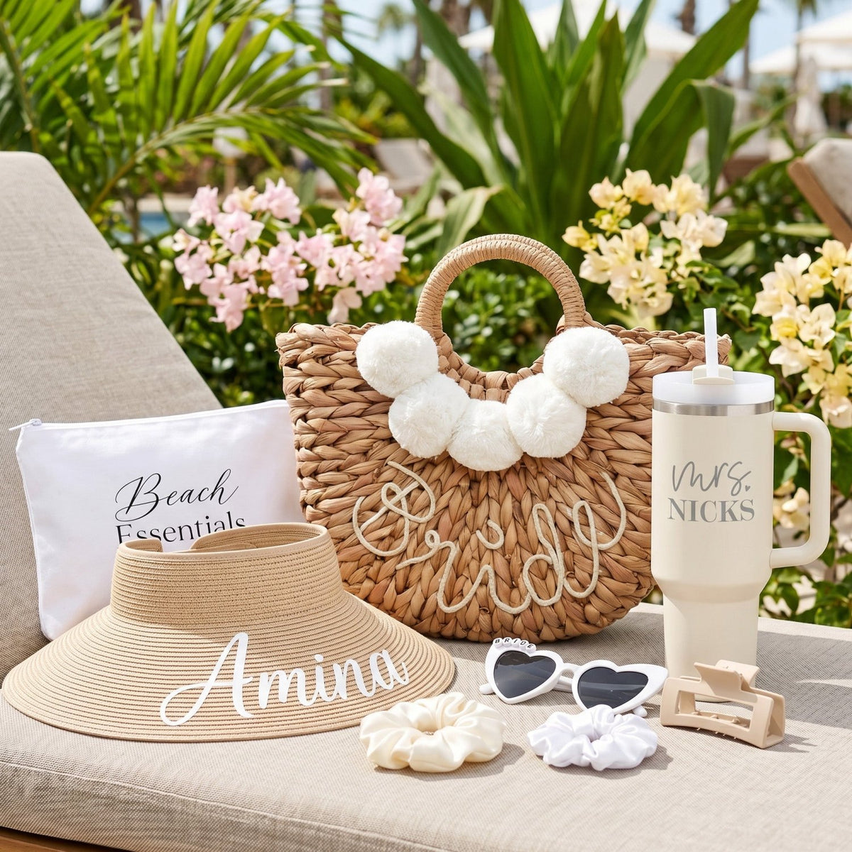 Bride gifts for bachelorette party with cute beach essentials like a personalized 40oz tumbler and personalized straw hat.