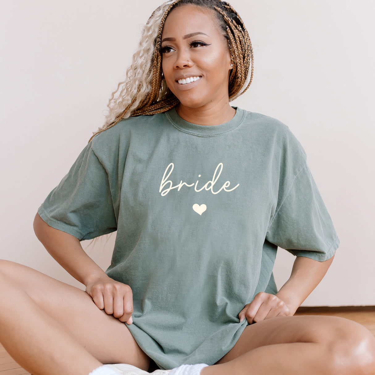 Woman wearing a custom Comfort Colors oversized bride shirt. It is styled casually as a bachelorette party shirt.