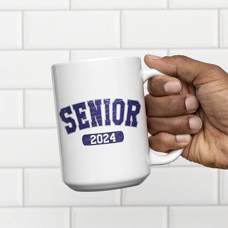 Man holding a Senior 2024 coffee mug designed to be a gift for 2024 senior graduates. All SKUs.