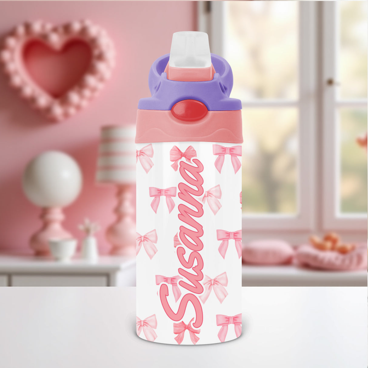 Coquette bow kids water bottle personalized with custom name and flip top lid, perfect for school or daycare hydration.