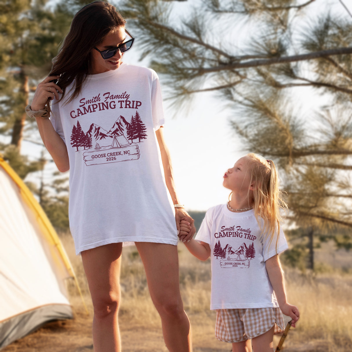 Matching camp shirts for family group hiking together in the forest wearing custom tees.