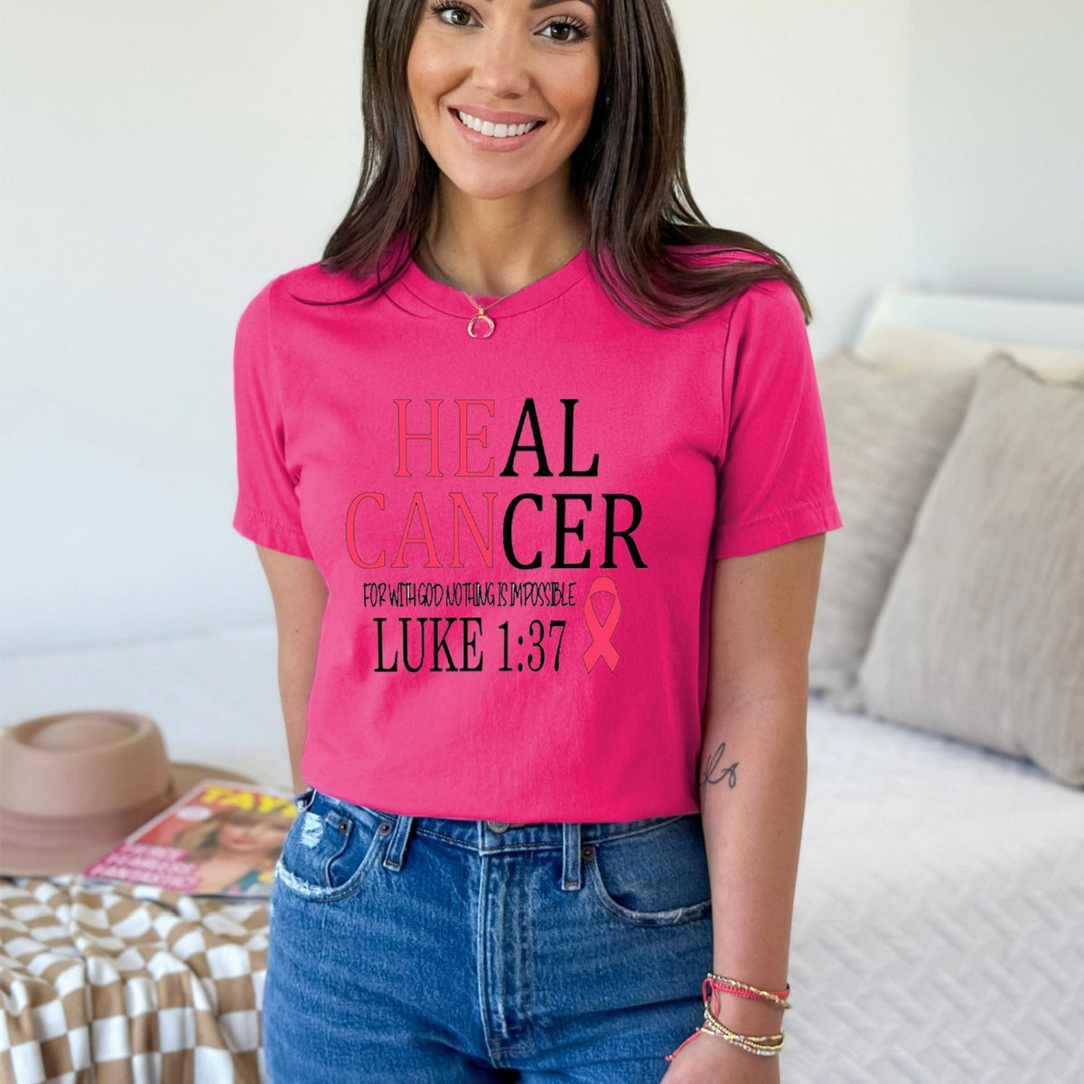 Women wearing a custom cancer shirt, he can heal cancer design. Chrisitan custom shirts for cancer patients.