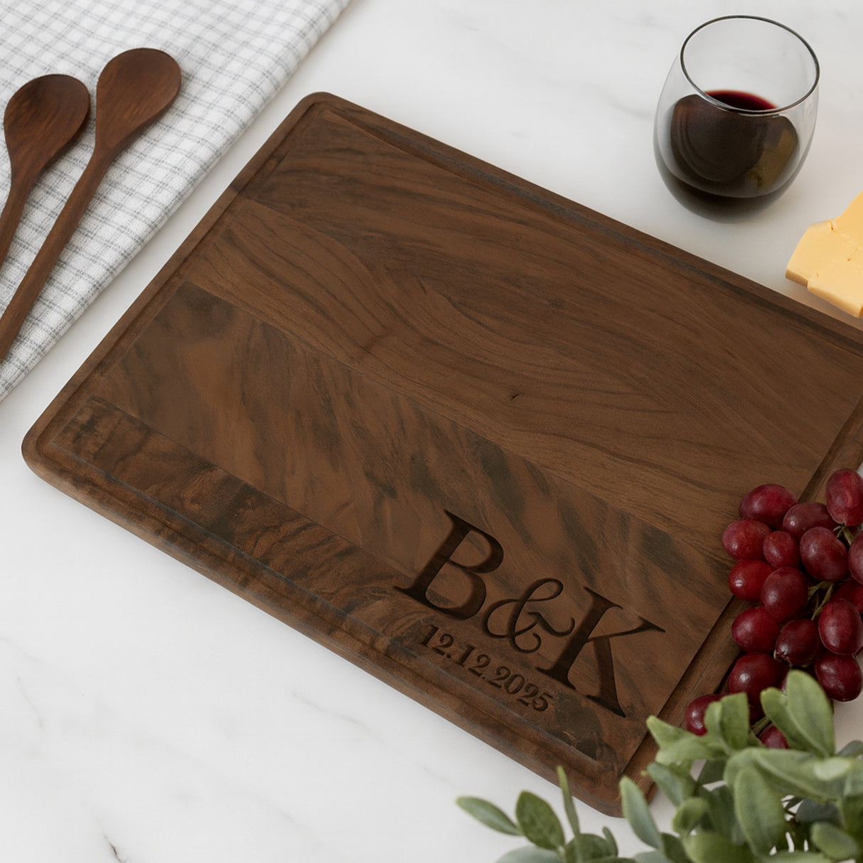 Dark walnut personalized cutting board for wedding gift. Custom with initials and wedding date.