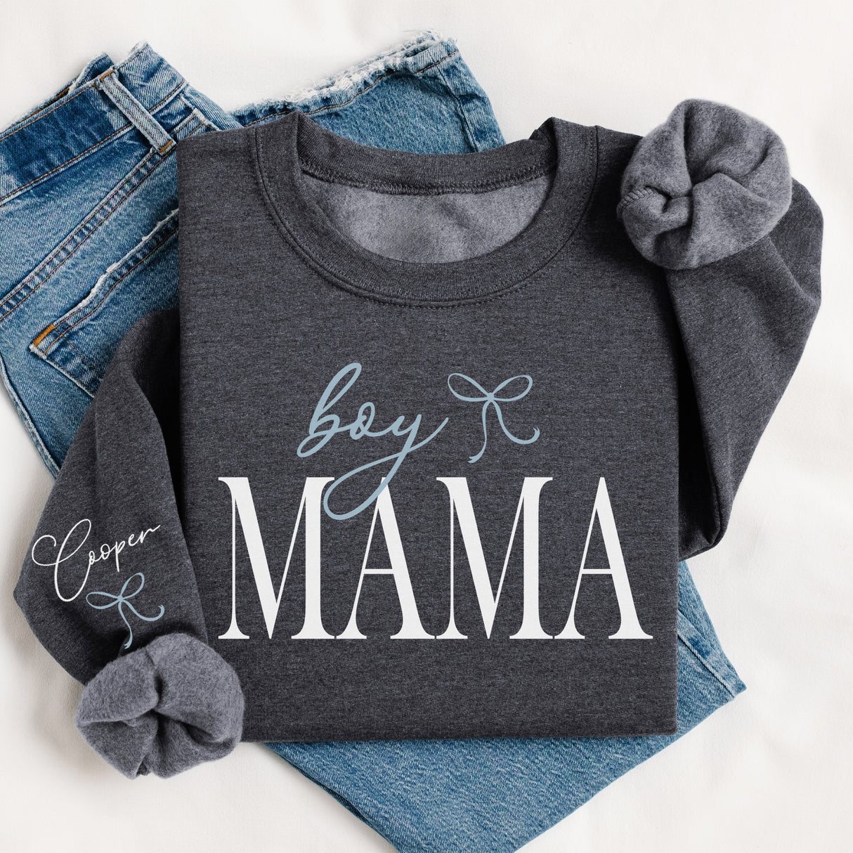 Flat lay of personalized Boy Mama Sweatshirt with kids names custom sweatshirt for moms. Personalized sweatshirt for moms with kids names perfect Mother’s Day gift.