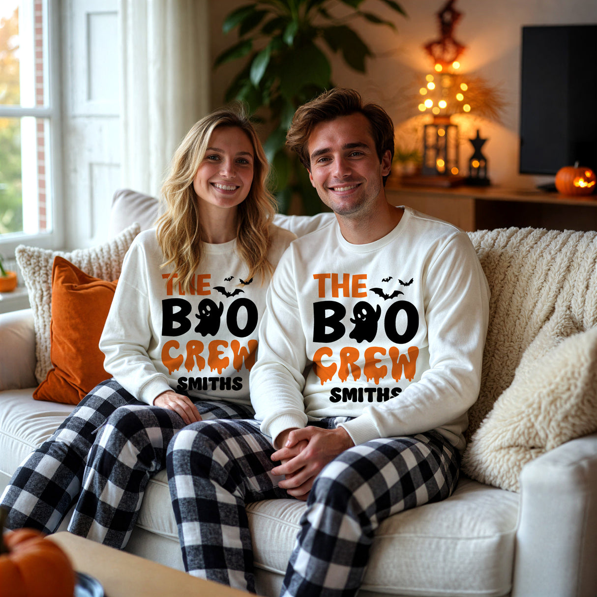 Personalized couples matching Halloween pajamas with name and The Boo Crew design.
