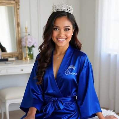 Elegant blue robe for a dama in a quinceañera celebration, with custom name for a perfect photo moment.