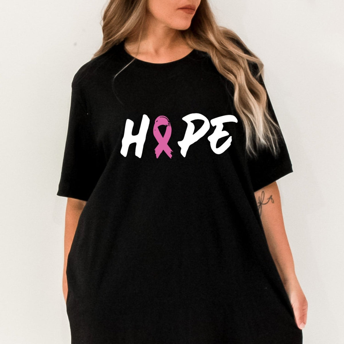 An empowering T-shirt designed to inspire strength and hope during Breast Cancer Awareness Month.