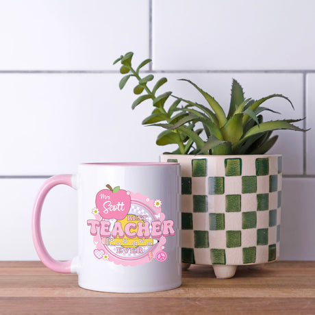 Personalized pink coffee mug with Best Teacher Ever design, custom name teacher gift.