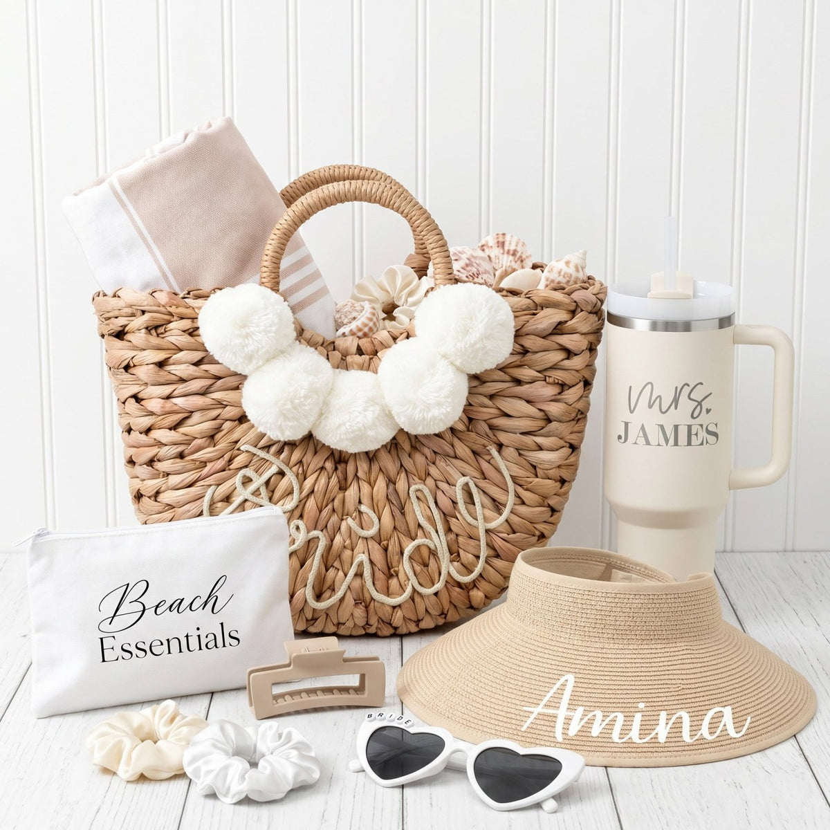 Bachelorette party gifts for bride with a wicker beach tote, personalized 40oz tumbler, personalized straw hat, cosmetic pouch, bride sunglasses, a hair claw clip and 2 scrunchies.
