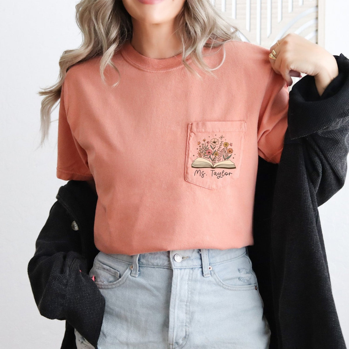 Teacher appreciation shirt with custom name and floral design worn by woman, Comfort Colors brand.