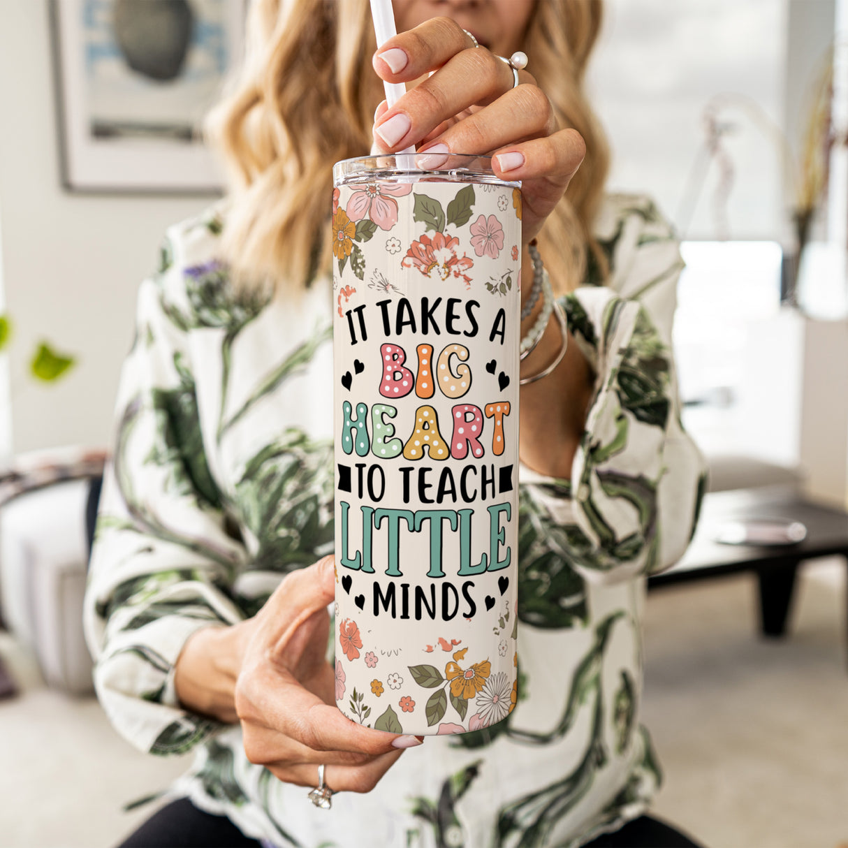 Teacher appreciation gift, custom floral tumbler with name. Women holding teacher tumbler which is the perfect gift for teachers.