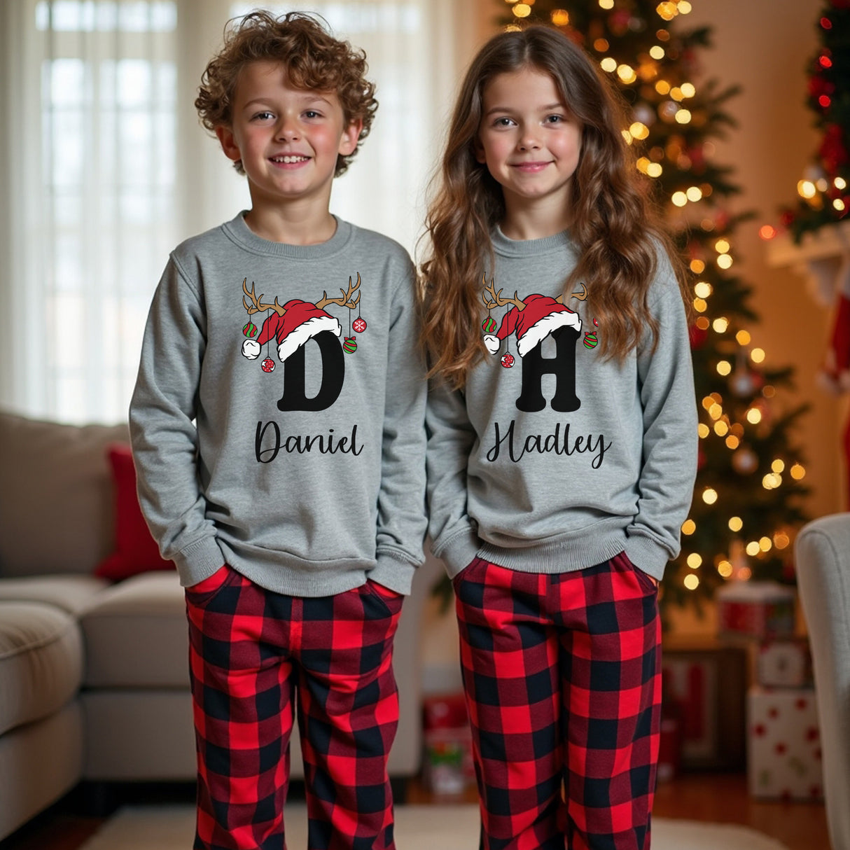 Adorable youth Christmas pajama set with a personalized sweater and red and black plaid joggers.