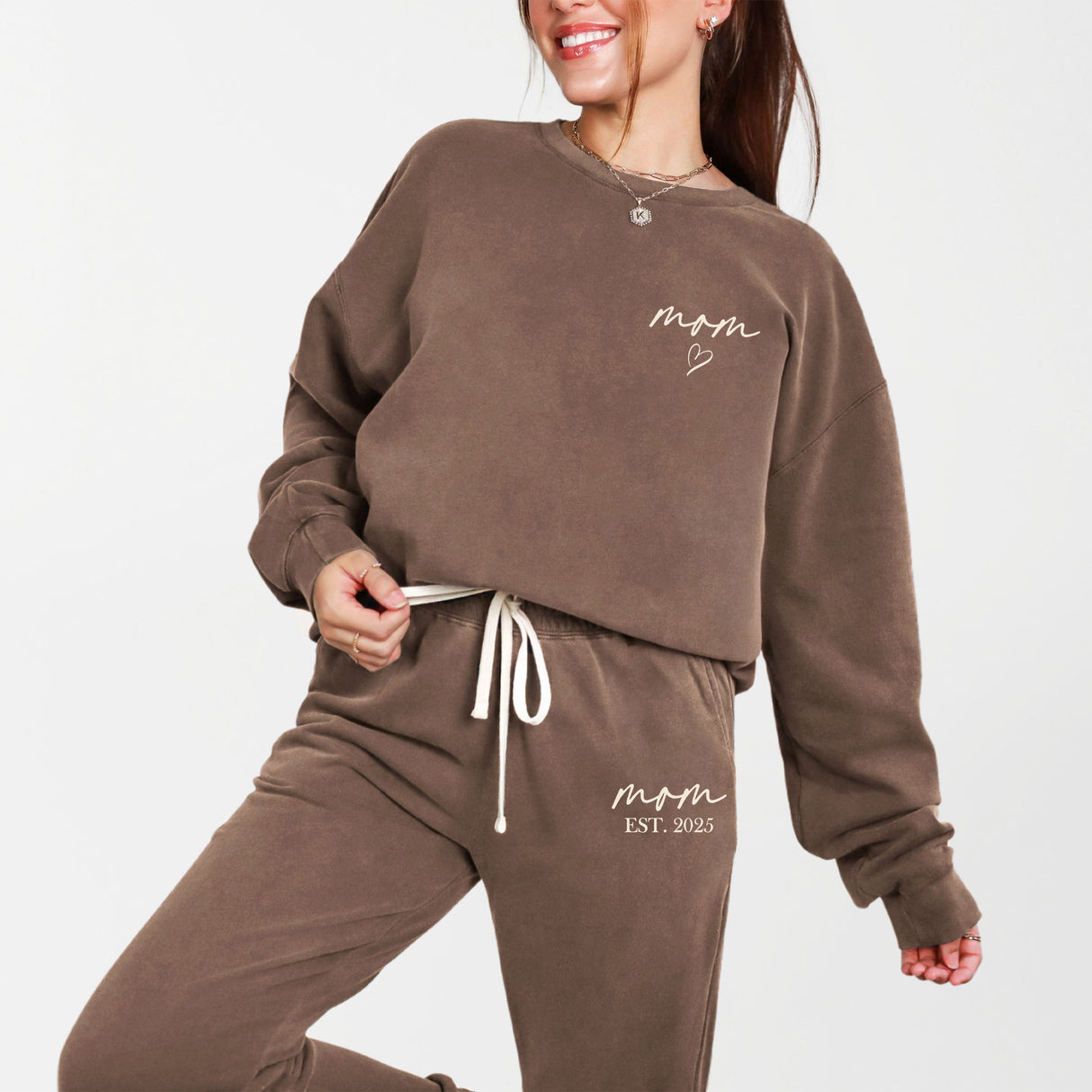 Woman wearing personalized mom sweat suit cozy lounge wear for ladies.