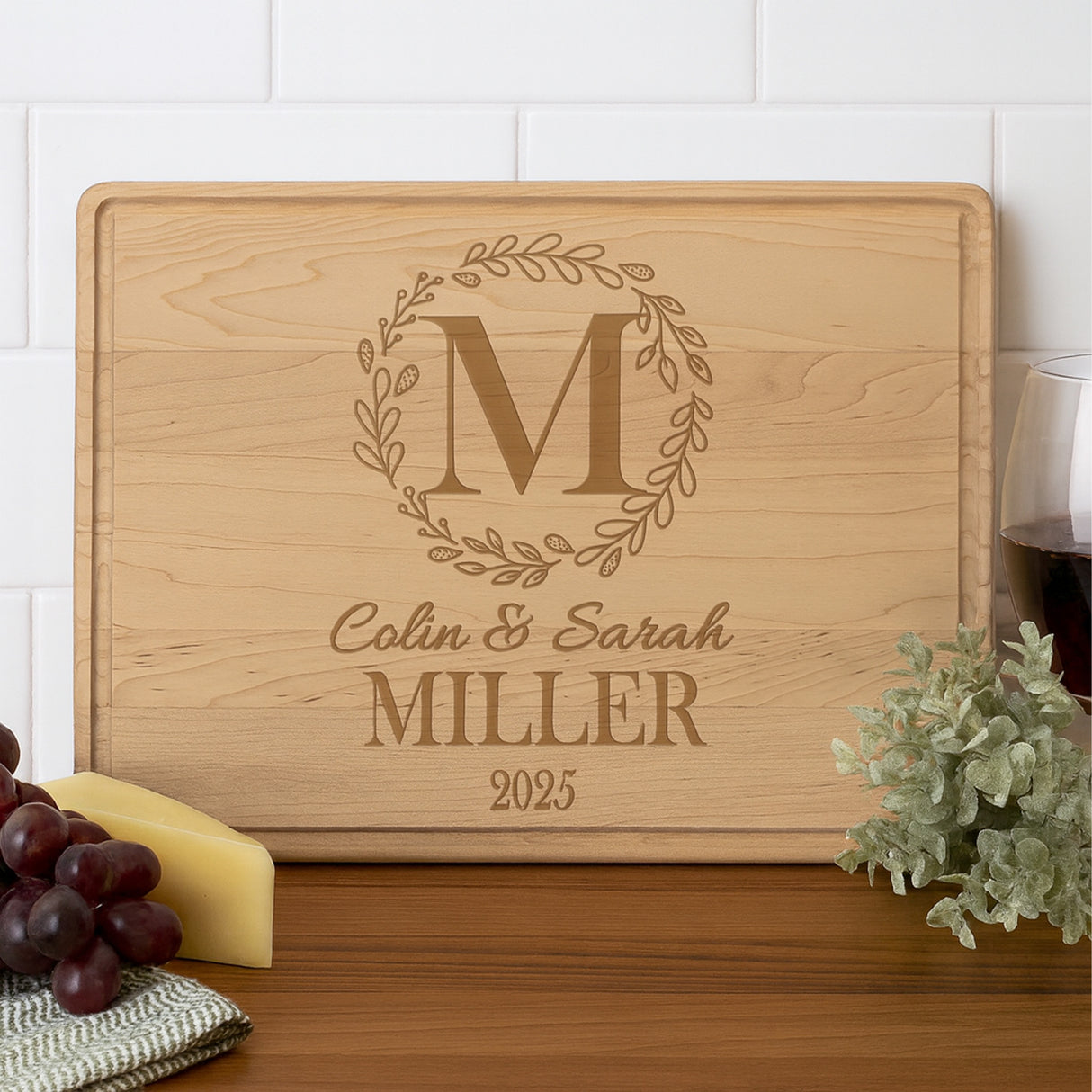 Personalized couples gifts. Maple wood cutting board engraved with names, last name, and wedding year, great for custom wedding gifts and anniversary presents.