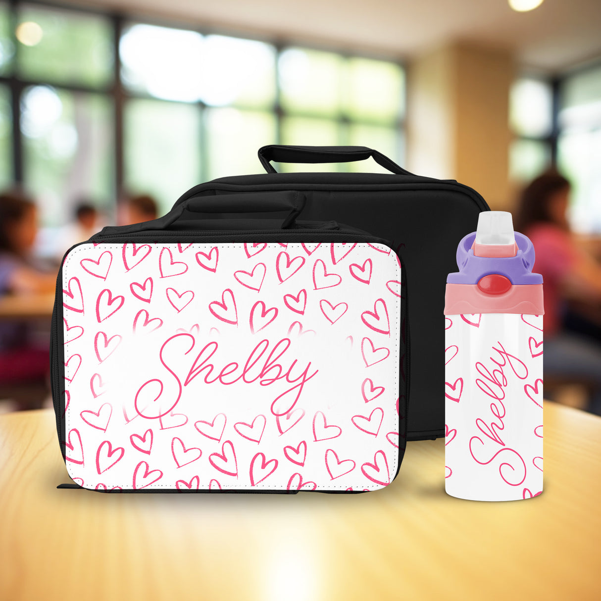 This bright personalized lunch box for girls includes a matching water bottle, making it a top choice for back to school gifts.