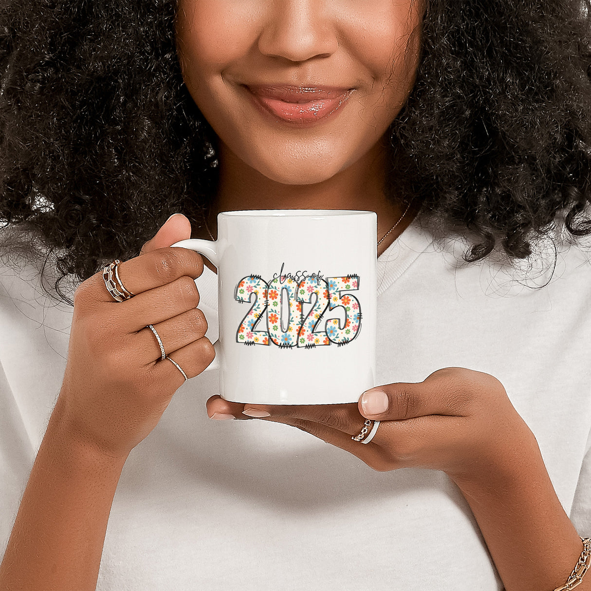 Decorative graduation mug with cute floral print, gift idea for female graduates. Aesthetic graduation coffee cup with flowers.