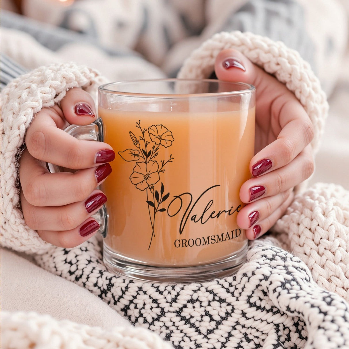 Bridesmaid holding custom birth flower mug, personalized clear or frosted iced coffee cup for bridal shower gift.