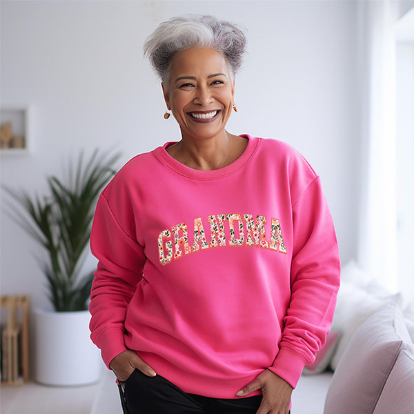 Pink floral grandma sweatshirt designed to make her feel special on mothers day and birthdays alike. All SKUs.