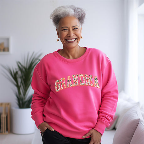 Pink floral grandma sweatshirt designed to make her feel special on mothers day and birthdays alike. All SKUs.