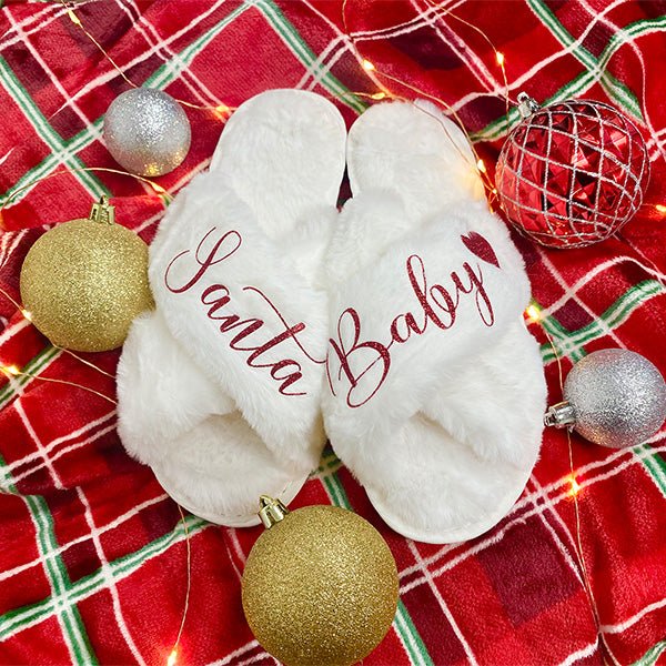 Santa Baby Christmas Slippers with other festive designs. These are criss-cross style fluffy slippers for women. Great gift for her during the holidays. all SKUs