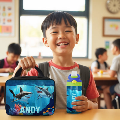 Shark lunch box and personalized water bottle, perfect for kids’ school supplies and first day gear.