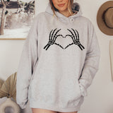 Heather Gray Hoodie with Skeleton showing heart hands for Halloween. all SKUs
