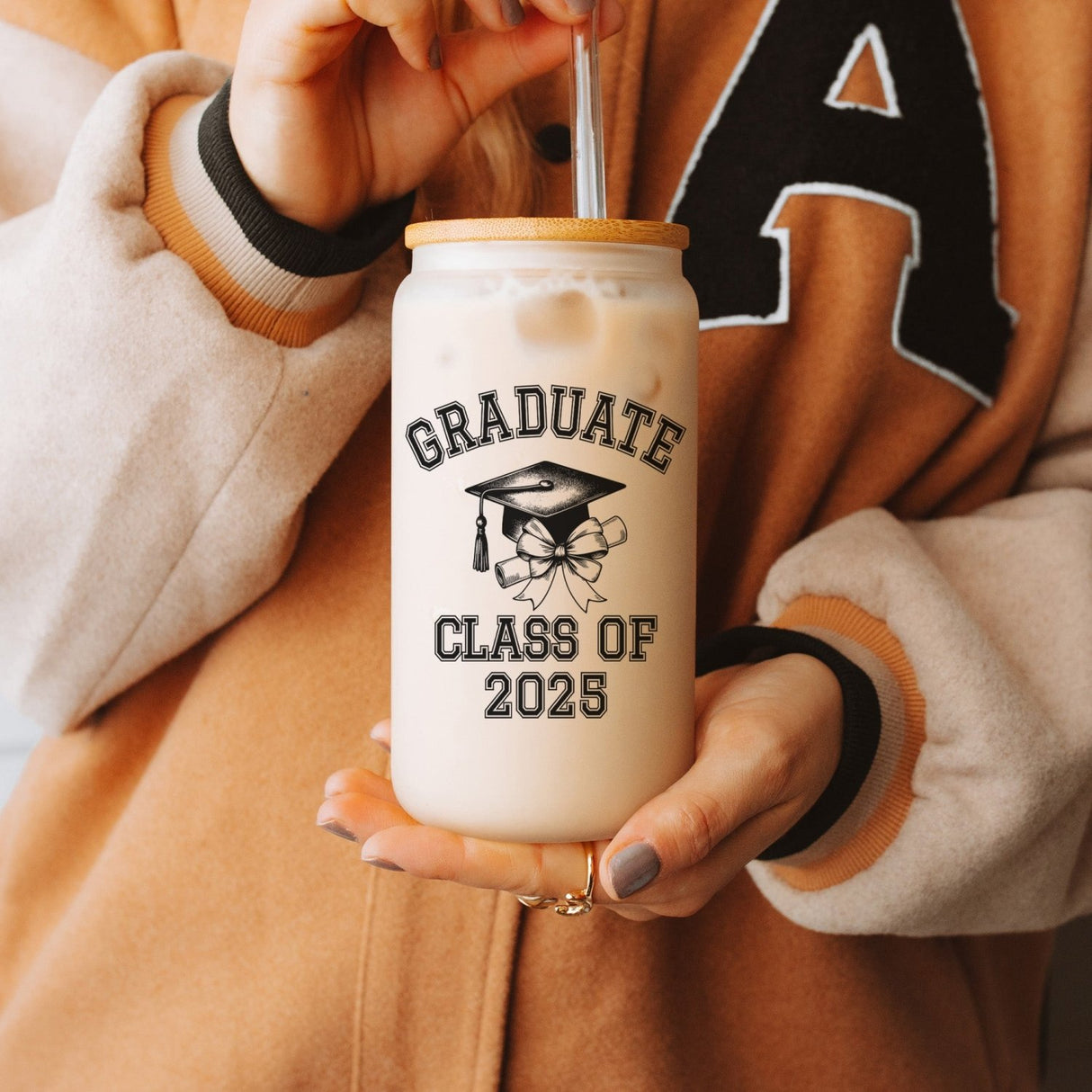 Clear iced coffee cup with sleek Class of 2025 text and custom name, a personalized graduation keepsake. Graduation party gift ideas for her.