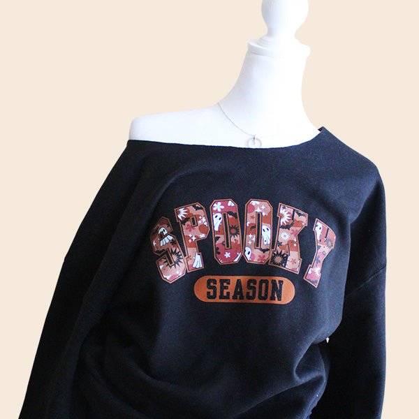 Halloween Sweatshirt for women and teens with Spooky Season graphics on the front. These are Off the Shoulder sweatshirts that can give you a trendy oversized look. all SKUs