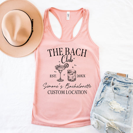 Custom bachelorette party tank tops flat lay with personalized bride and bridesmaid shirts, bridal party outfits, and matching bachelorette tanks for girls getaway.