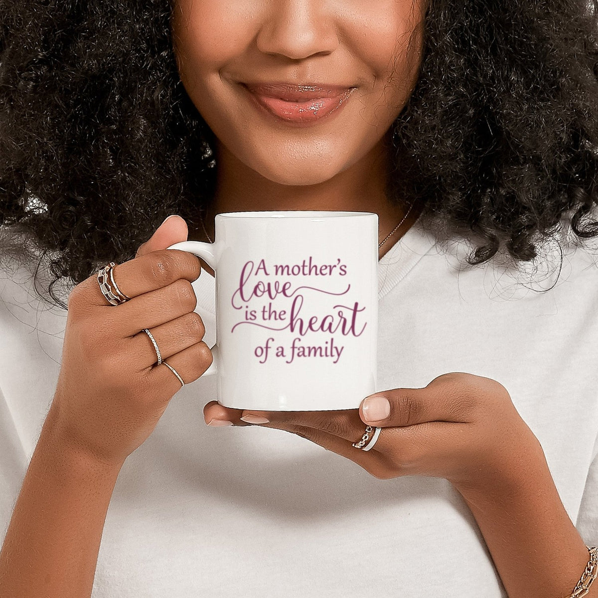 Mom using an adorable mothers day coffee mug with purple design.