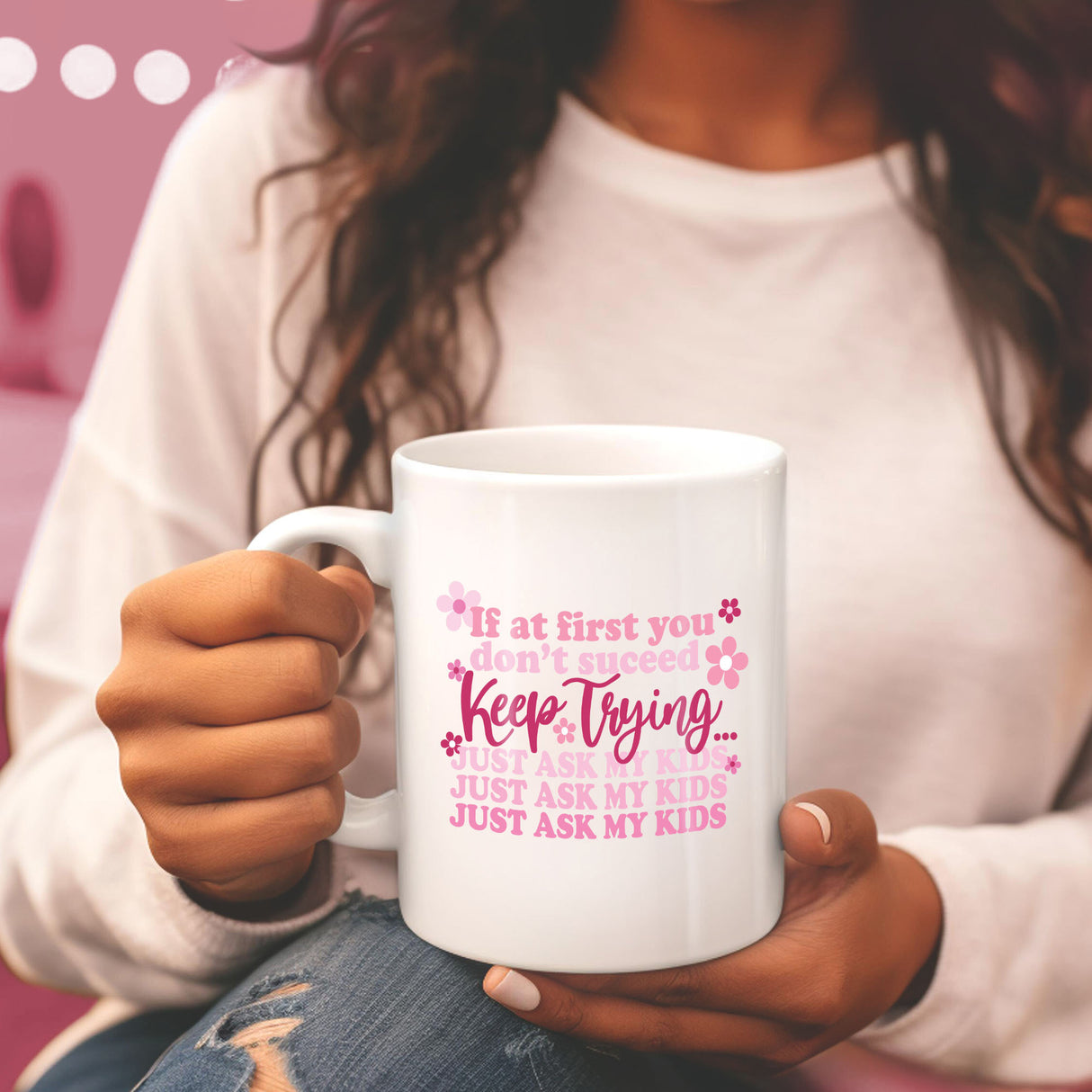Mom holding cute pink mug, with funny message. Best gift ideas for mom this mothers day.