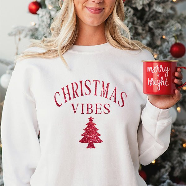 Christmas Sweatshirt for the holiday season featuring red glitter writing of Christmas Vibes with Christmas tree. Great for wearing in or out. all SKUs