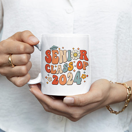 Woman holding senior class of 2024 coffee mug. The perfect graduation gift idea for her. All SKUs.