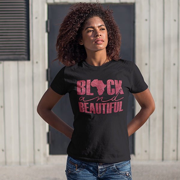 This is an example of our Black and Beautiful Tshirt worn with jeans. The model is wearing a Black t-shirt with red glitter lettering. These shirts are available in several styles and sizes.