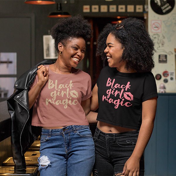 Our Black Girl Magic Shirts are available in two design styles. One with just text, and the other featuring a kiss. You can customize by selecting your print font, both glitter and standard is available.