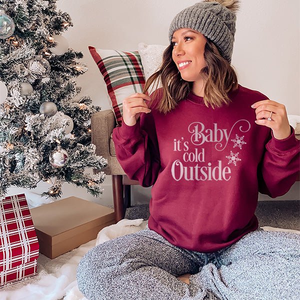 Baby it's cold outside cold weather wear for women. Features cute print with snowflakes. Made tol order womens sweatshirt. all SKUs