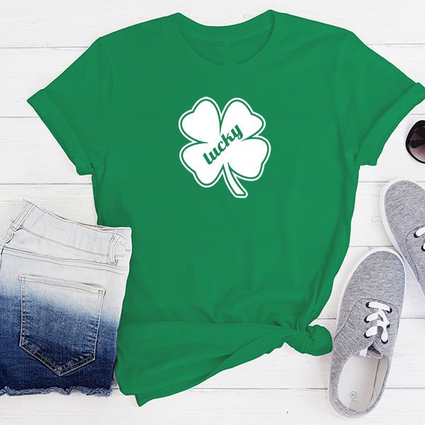 White crewneck style shirt with green lucky clover for St. Patricks Day. These shirts are available in a variety of styles and sizes.