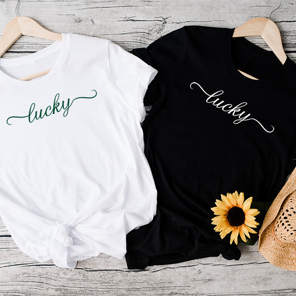 Our lucky print on a white tee shirt and a black tshirt in green and white print.  All shirts are made to order just to your preference.