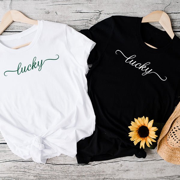 Our lucky print on a white tee shirt and a black tshirt in green and white print. All shirts are made to order just to your preference.