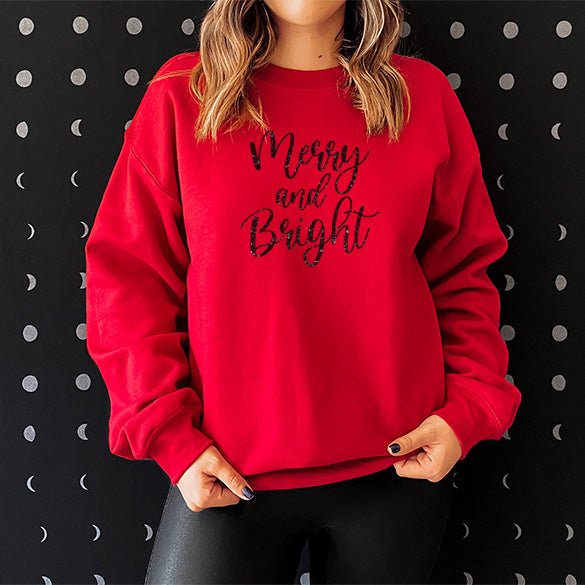 Red Merry and Bright Christmas Sweatshirt with black glitter writing. Can be dressed up or down. all SKUs