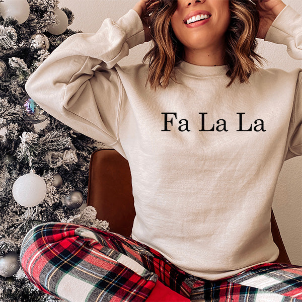 Christmas Sweatshirt with Fa La La text with black print. Available in XS to 5XL. all SKUs