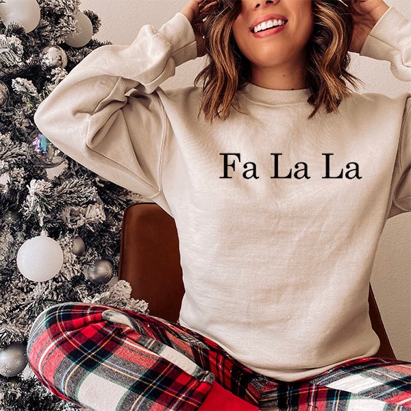 Christmas Sweatshirt with Fa La La text with black print. Available in XS to 5XL. all SKUs