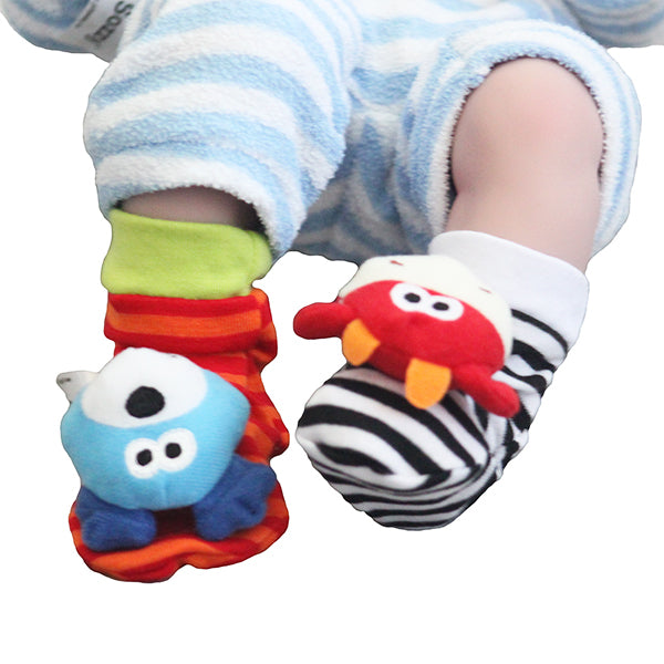 sozzy foot socks rattles dog cow pair closeup