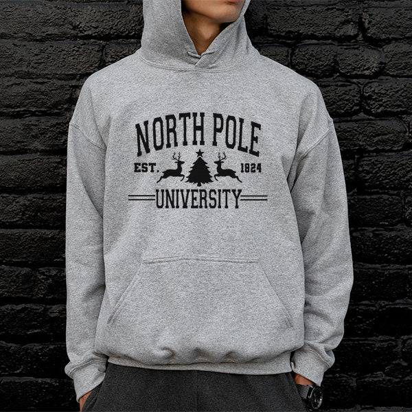 North Pole University Christmas Hoodie. A great gender neutral hoodie for the Christmas season featuring reindeers and a Christmas tree. all SKUs