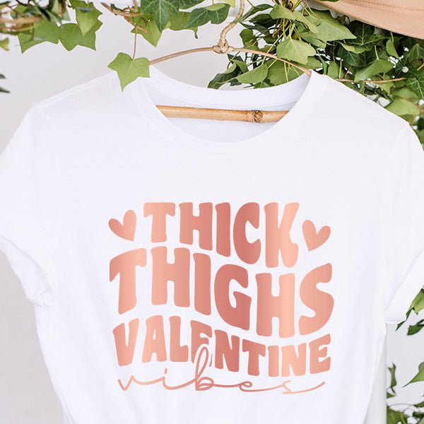 Shop our Thick Thighs Valentine Vibes tops that are available as a tshirt, crop top, crop hoodie, long sleeve tee, sweatshirt or hoodie. We offer several colors and sizes from XS to 6XL. all SKUs