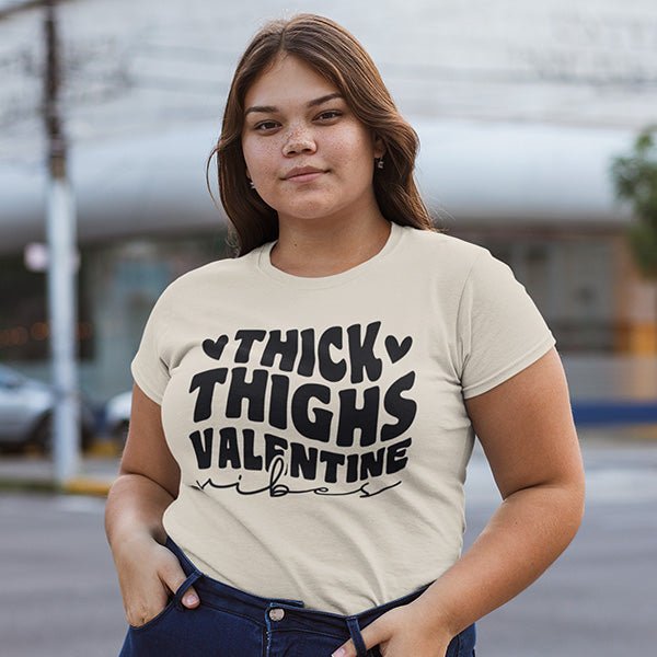 Valentines Day Shirts for Plus Size Women with the phrase Thick Thighs Valentine Vibes in standard or glitter print. Rock with a nice pair of jeans that shows those curves. all SKUs