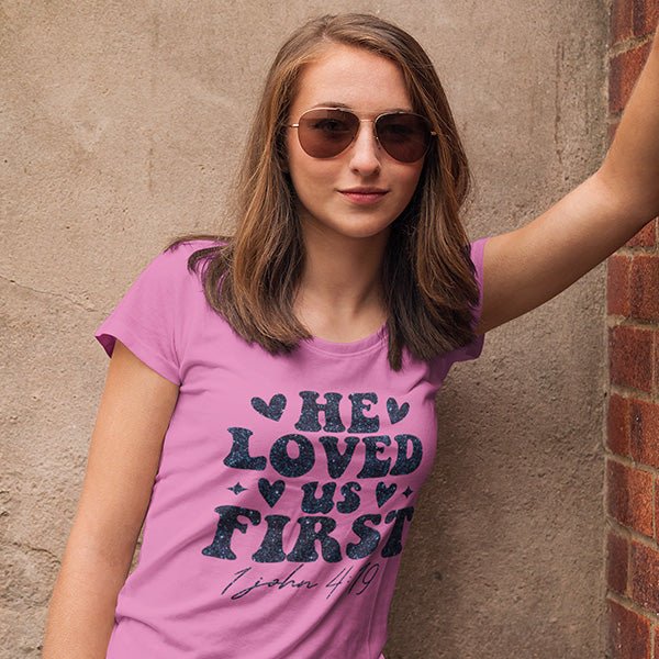 This shirt features the text He Loves Us First and the bible reference of 1 John 4-19. It's a great Christian shirt for youths, women and men. all SKUs