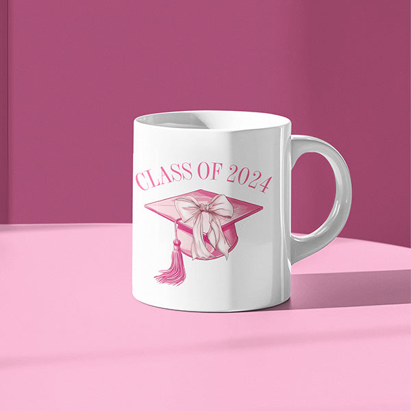 Pink class of 2024 coffee mug with pink background. All SKUs. 